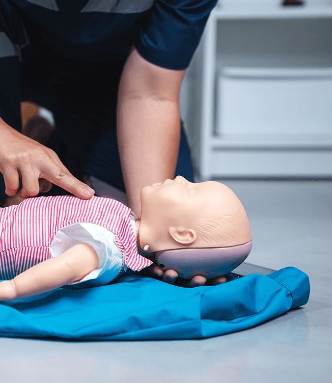 Infant CPR on a training manikin